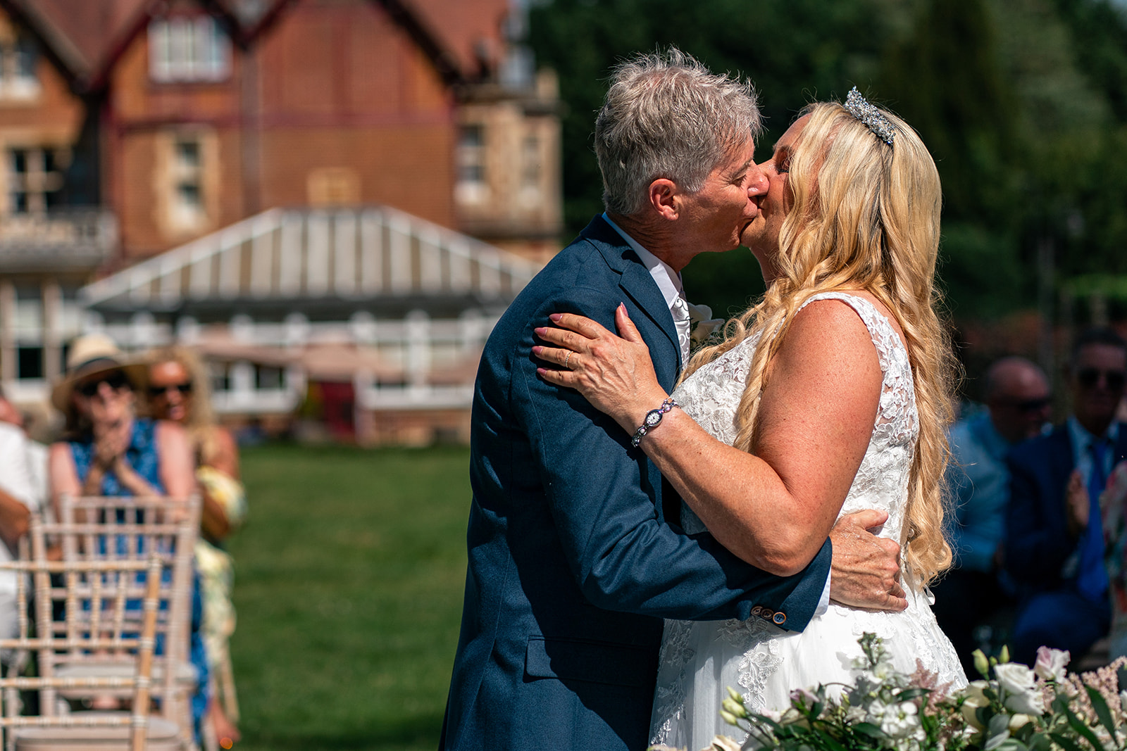 bride and groom having a kiss just after their ceremony outside.