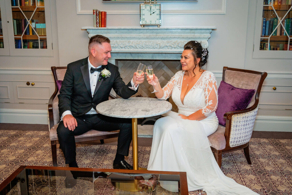 wedding timeline - bride and groom having a glass of champagne