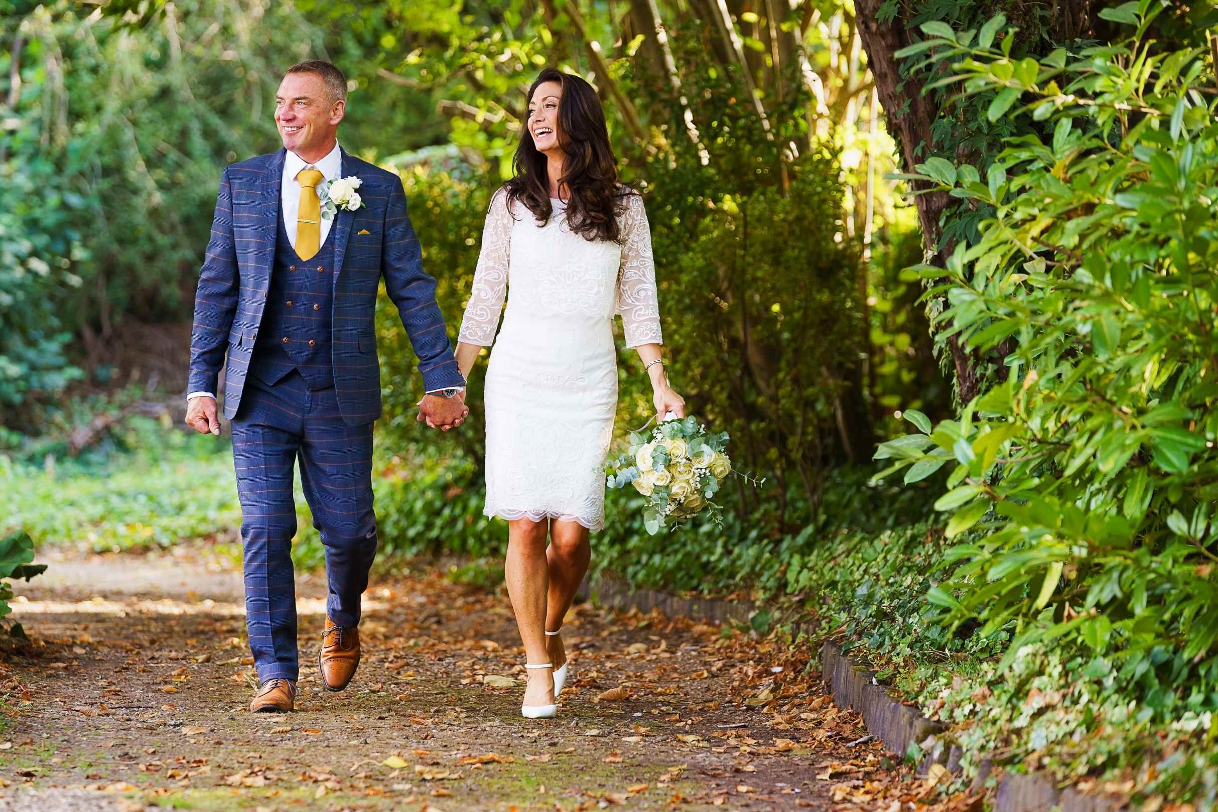 bride and groom walking in the grounds of st michaels manor