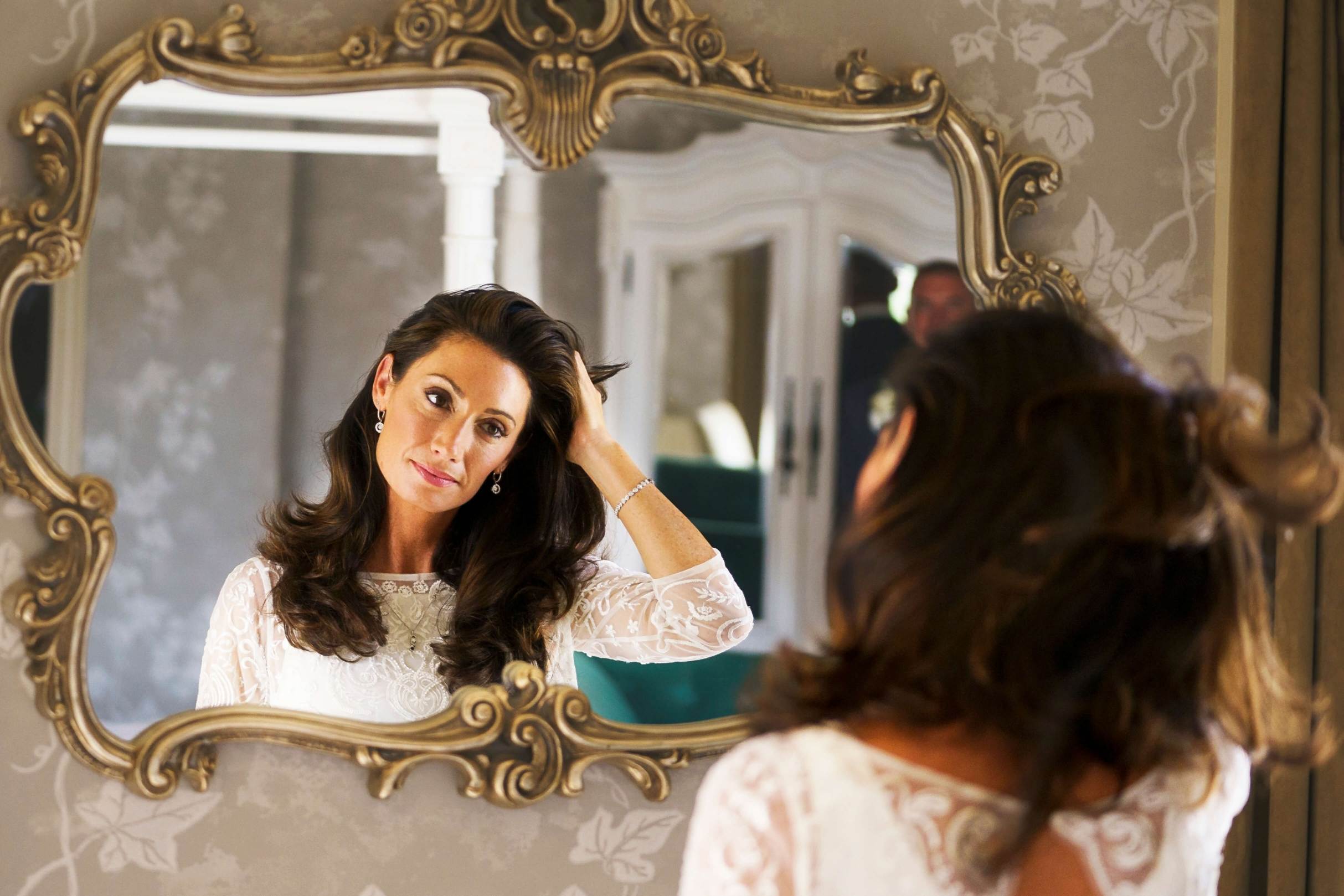 bride looking in the mirror