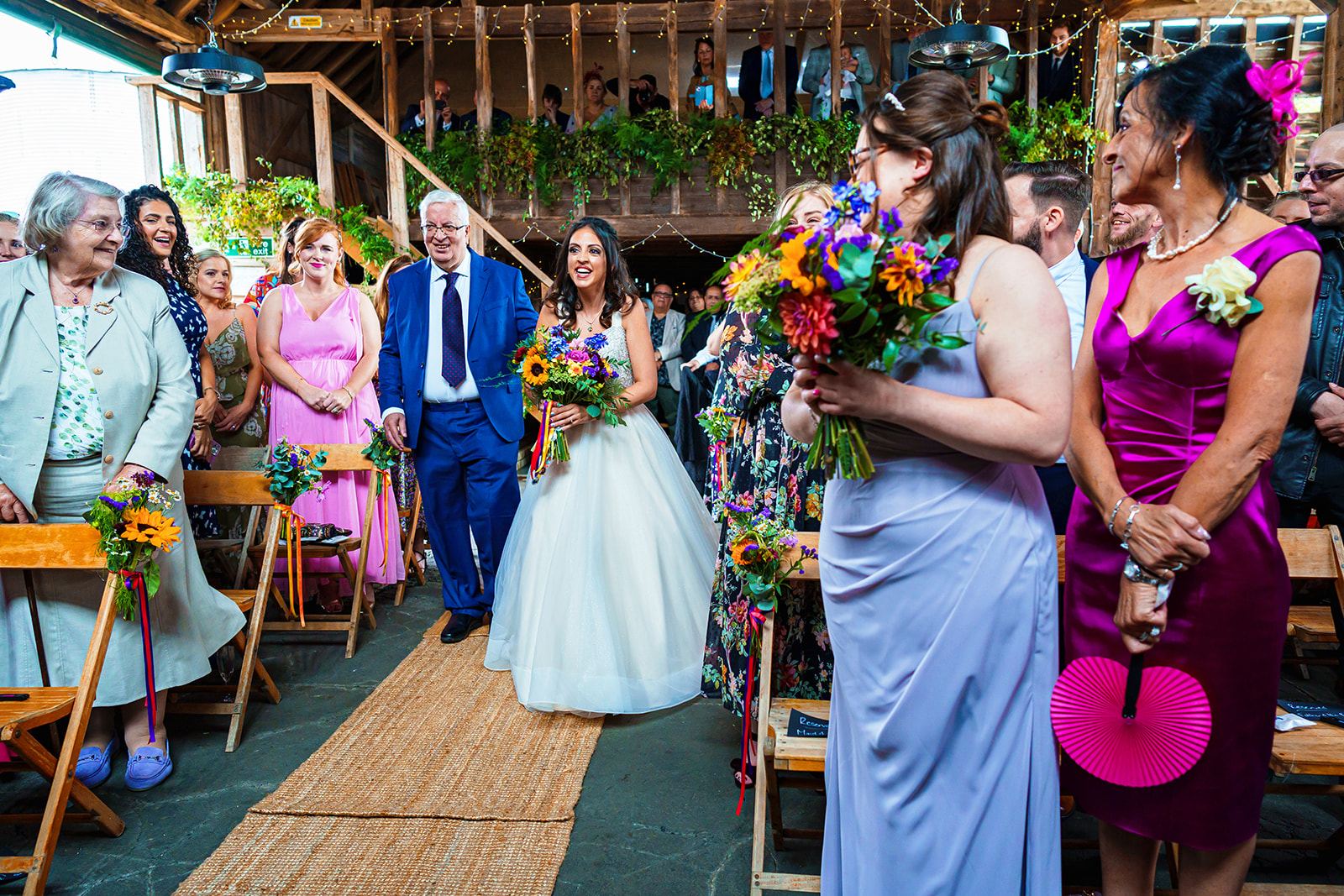 the barns at lodge farm - bride walks down the aisle with her dad