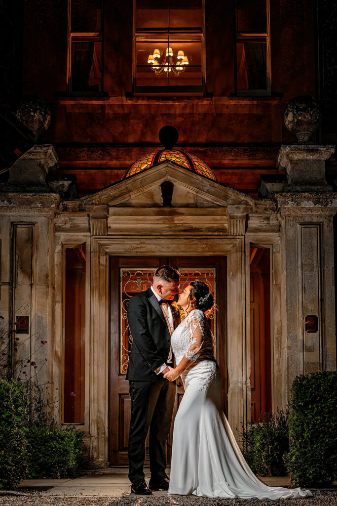 wedding at down hall - evening shot of bride and groom out the front of down hall