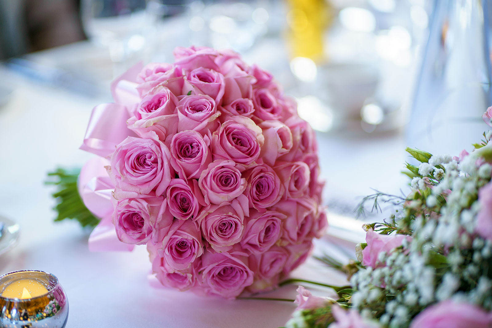 how much does a wedding cost - a bouquet of prink roses