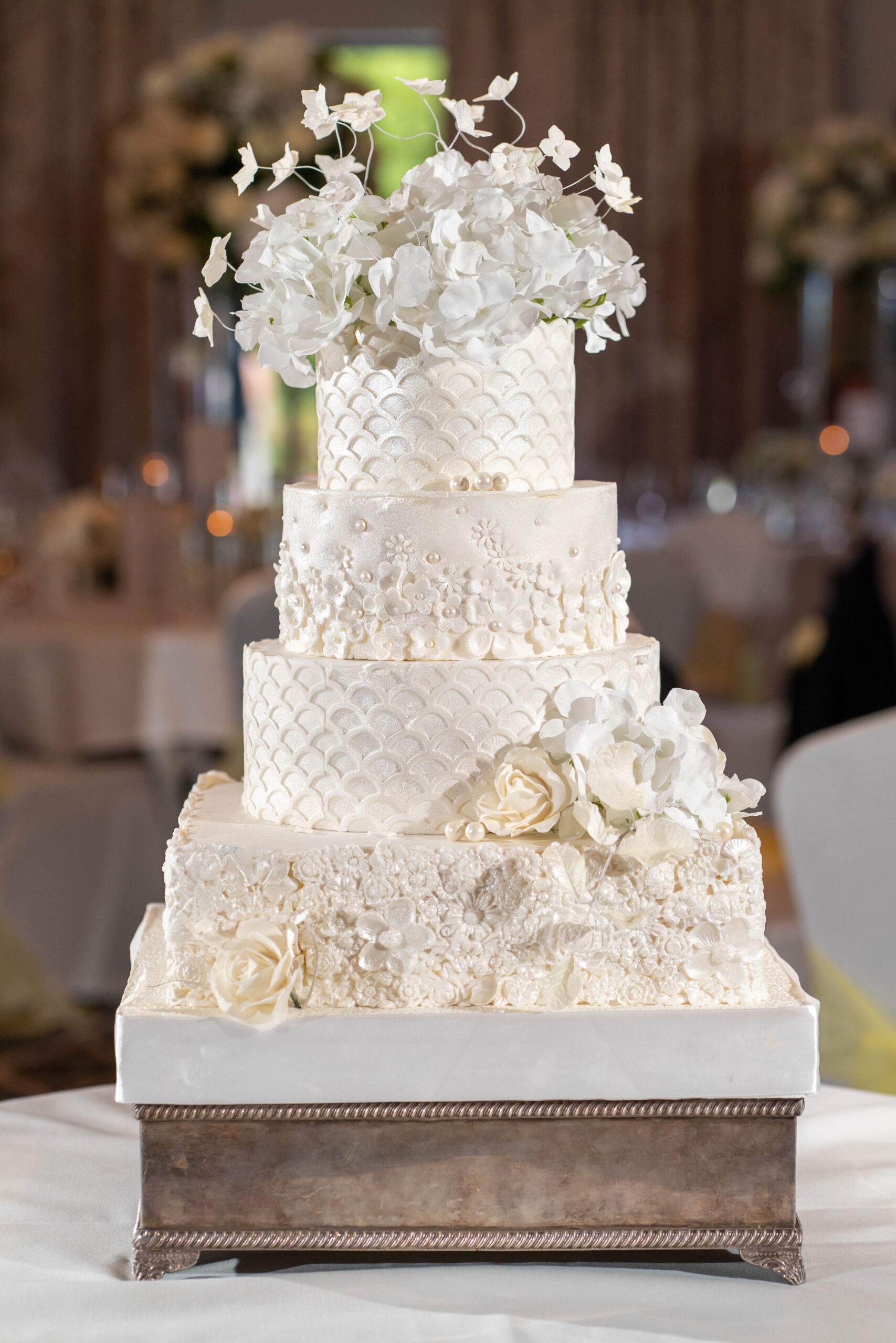questions to ask wedding suppliers - white 4 tier wedding cake