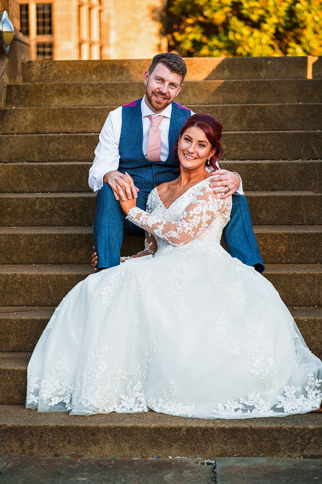 fanhams hall - bride and groom on steps outside