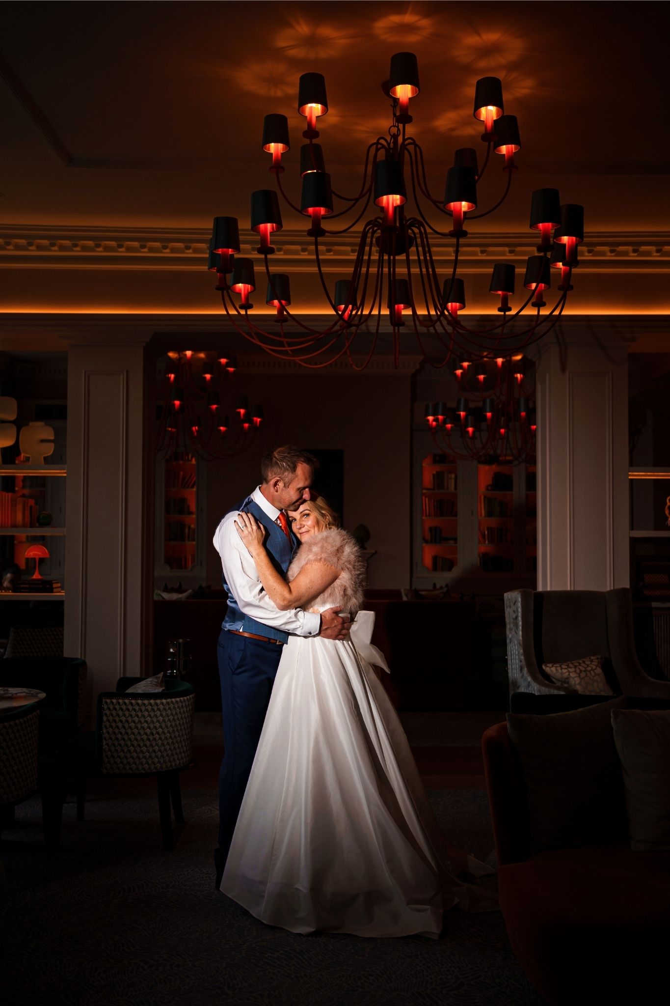 bride and groom having an artistic shot at night in the bar