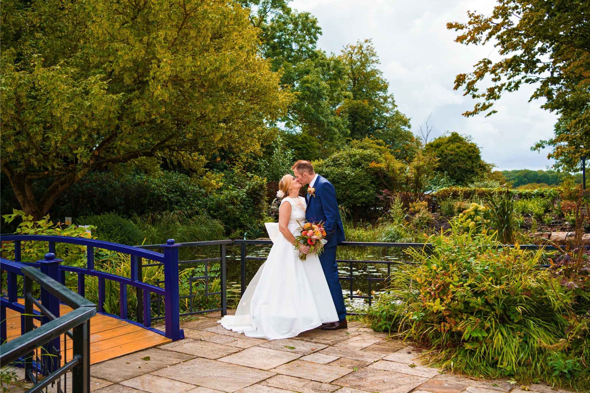 bride and groom on bridge at sopwell house