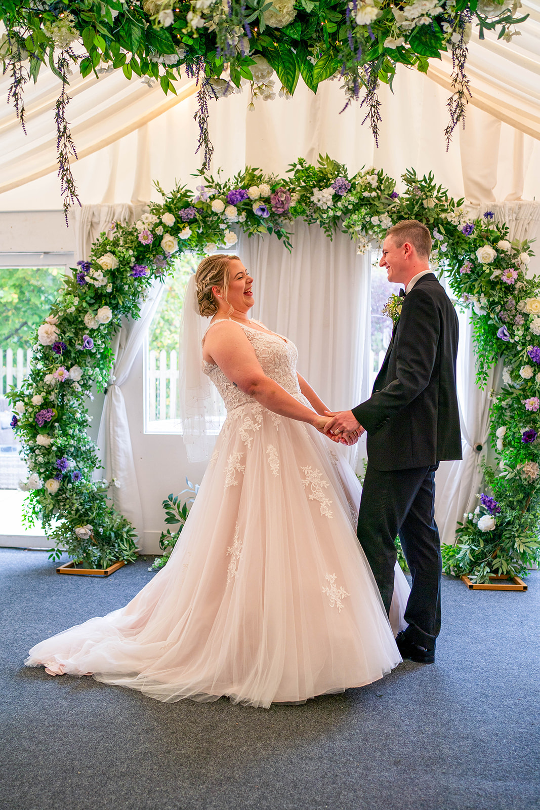 the waterside - bride and groom say i do