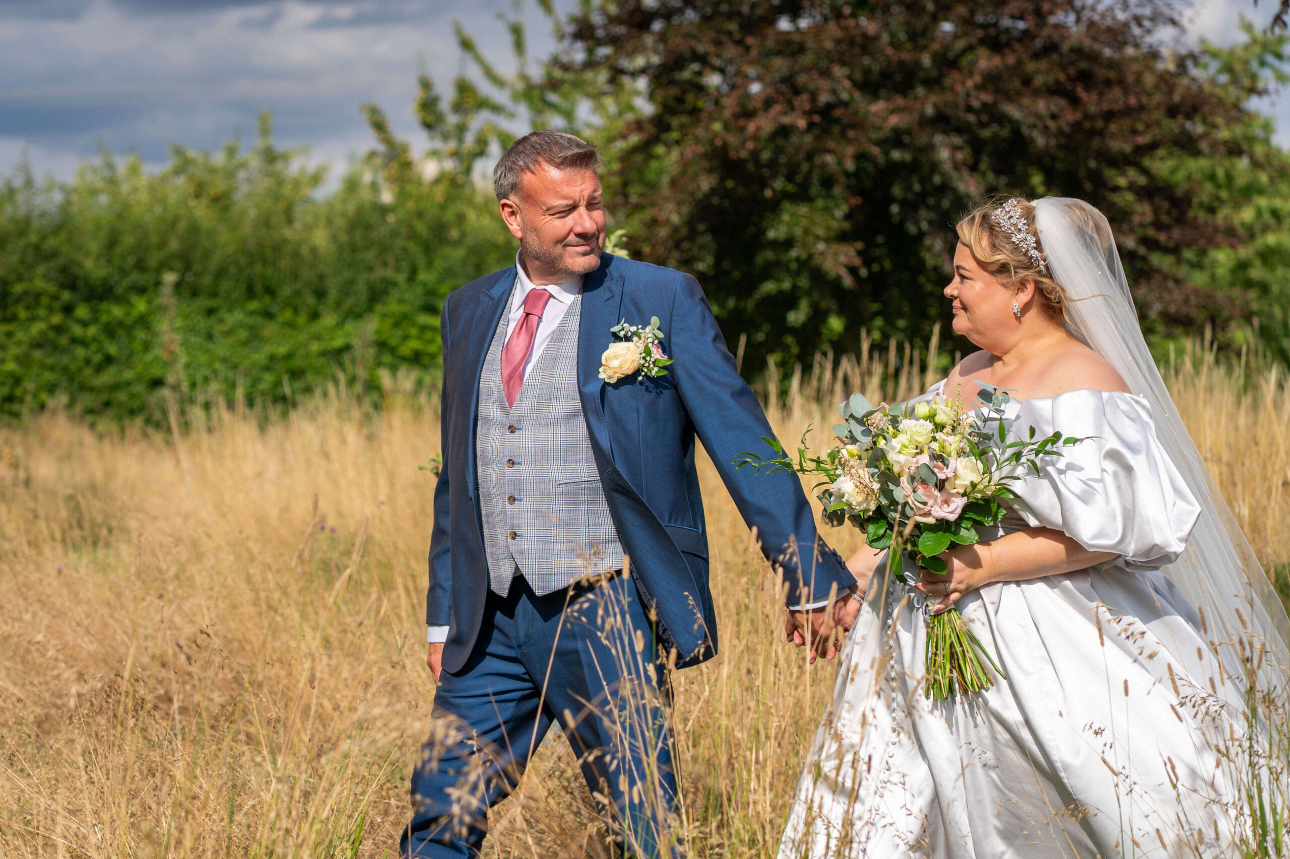 south farm wedding - couples portraits in the long grass