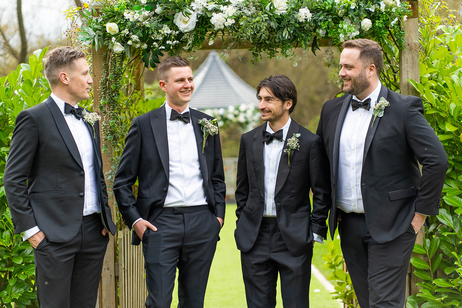 the waterside - groomsmen in tux