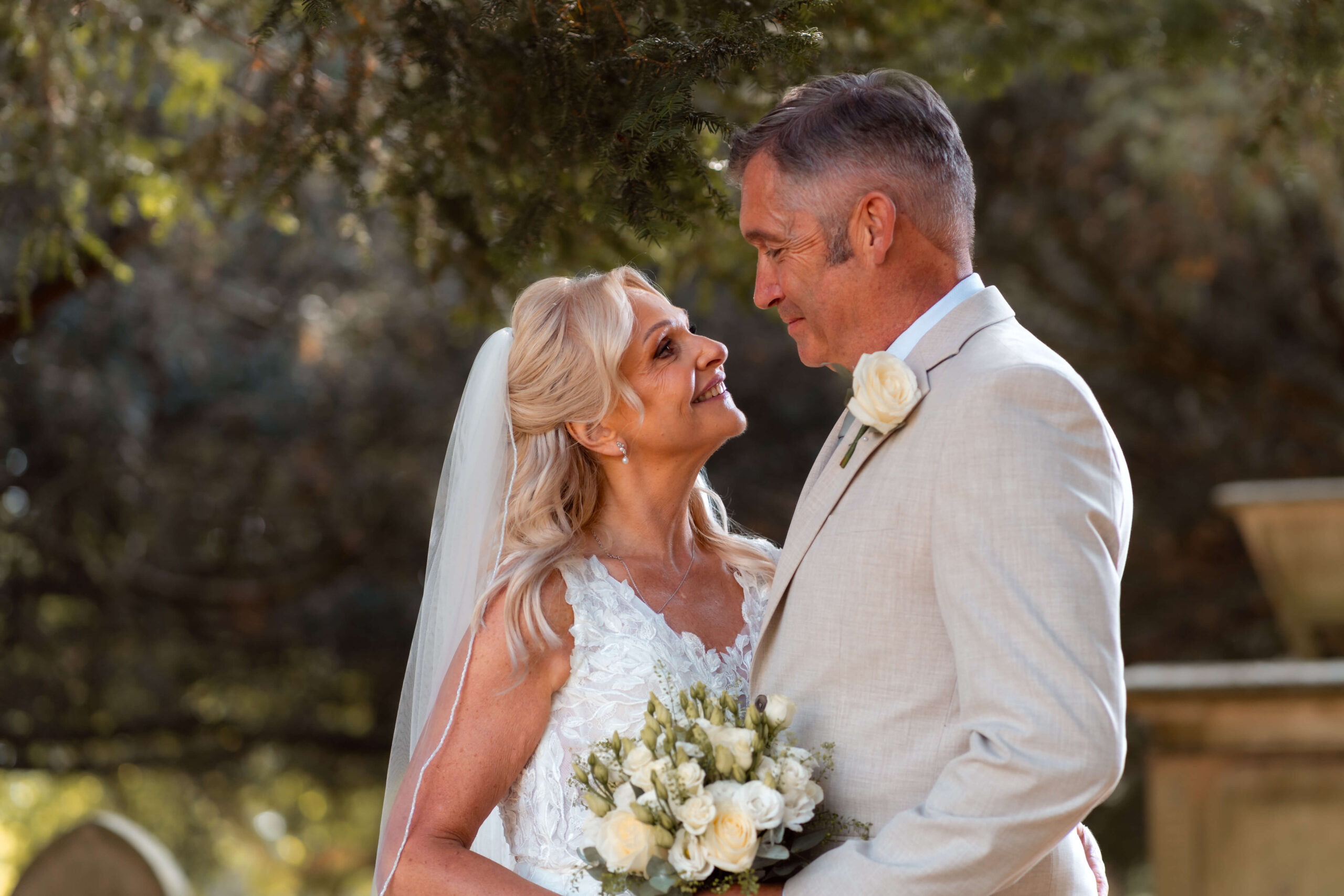 mature couple looking into each others eyes on their wedding day