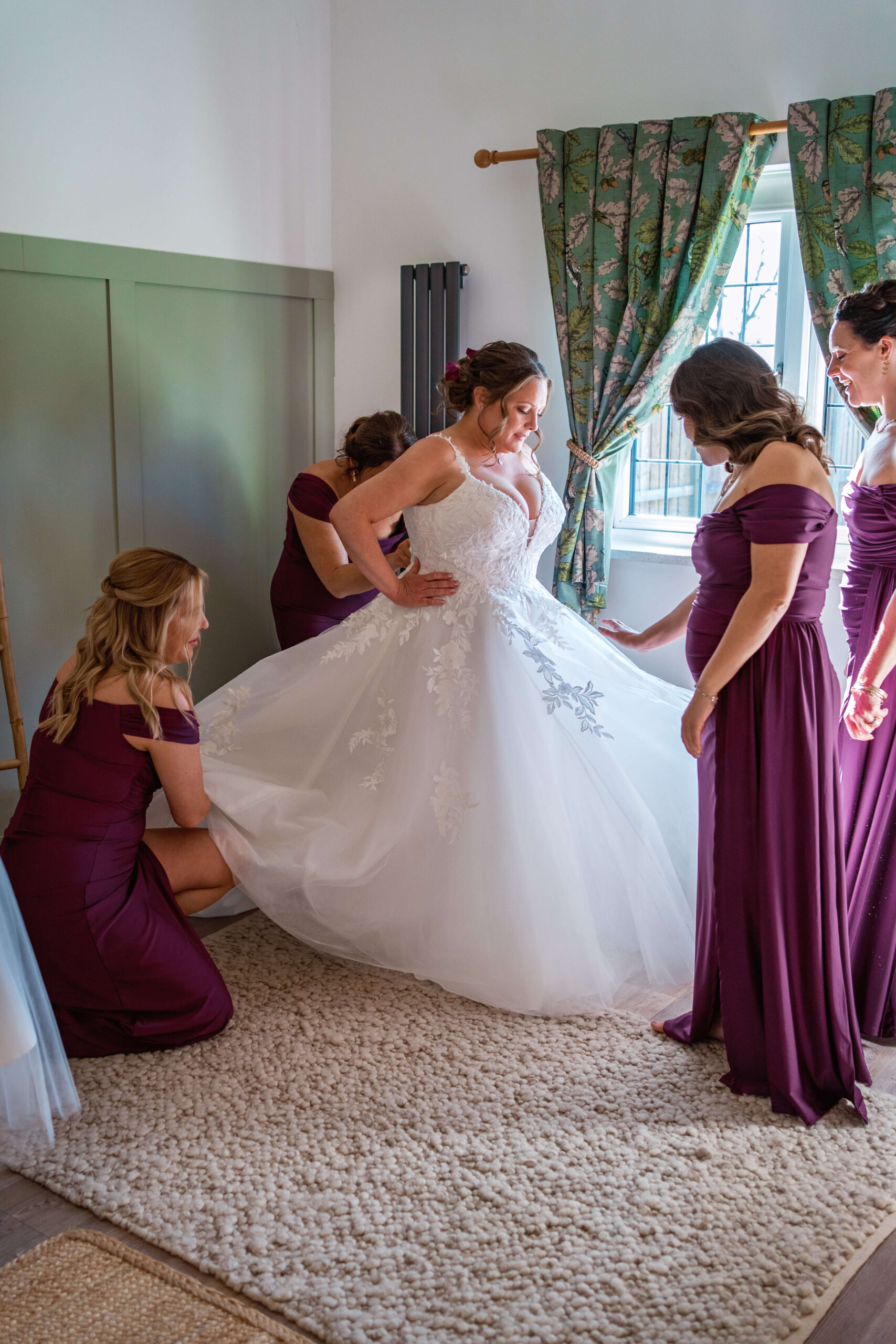 mature bride gets ready with her bridesmaids